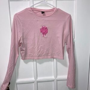 pink cropped long sleeve graphic print